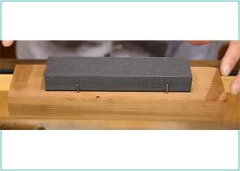 Sharpening Stone on a wooden frame